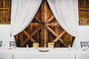 Balls Falls wedding barn door backdrop draping head table