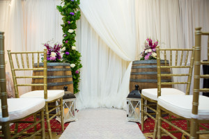 gold chiavari chairs, wine barrels, wedding ceremony backdrop, lanterns