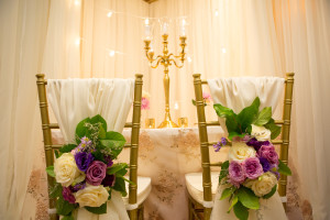 Twinkle backdrop, gold candelabra, chair decor, lace linen, chiavari chairs