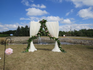 Wedding Ceremony Backdrop with garland at Hernder Estate Wines