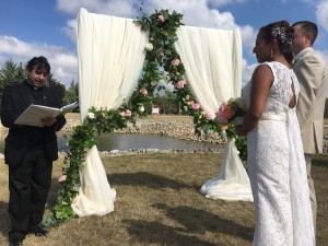 Wedding Ceremony backdrop with garland and Hernder Estate Wines